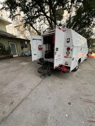 Magnet Plumbing service vehicle on-site for Water Heater Repair in Delgado